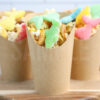 The Sea Life Snack Cups comes in a brown fry cup with rustic wood backdrop.