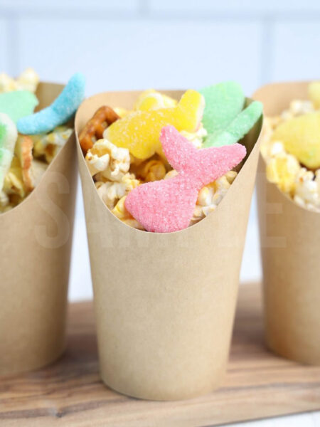 The Sea Life Snack Cups comes in a brown fry cup with white wood backdrop.