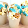 The Shark Snack Cups comes in a brown fry cup with white wood backdrop.
