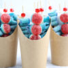 The Brain Candy Cups comes in a brown fry cup with marble wood backdrop.