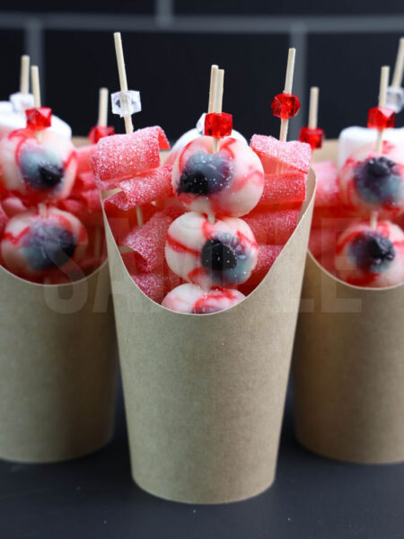 The Eyeball Candy Cups comes in a brown fry cup with black wood backdrop.