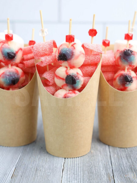 The Eyeball Candy Cups comes in a brown fry cup with gray wood backdrop.